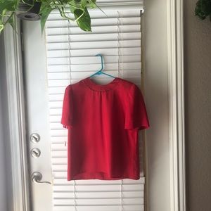Red silky blouse